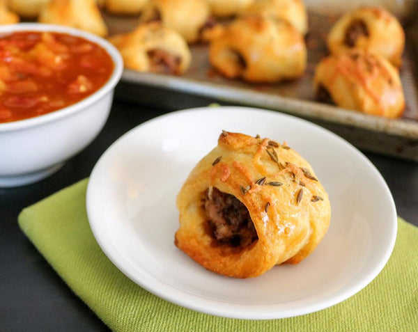 Chili grande sausage rolls made with Raven's Nest chili grande seasoning with a side of Raven's mango salsa