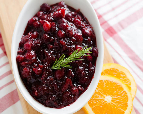 Cranberry sauce made with Raven's Nest mulling spice garnished with rosemary and oranges