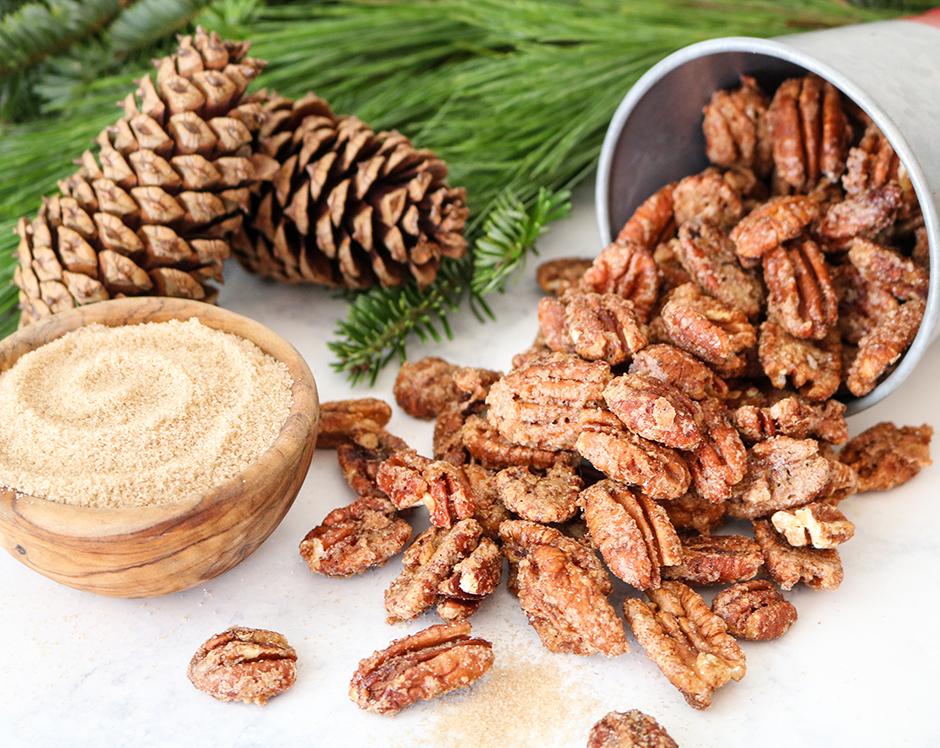 Spiced pecans recipe made with Raven's Nest mulling spice, garnished with cinnamon and Christmas foliage